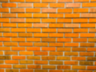 Blur brick  wall background with vignette and classic.Color vivid