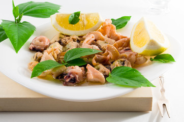 Seafood salad on a white plate.