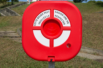 A security box hiding a lifebuoy by the river