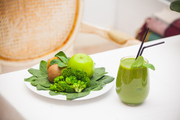 Healthy green smoothie and ingredients - superfoods, detox, diet, health, vegetarian food concept.