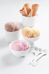 Various ice cream bowls in the different cups.