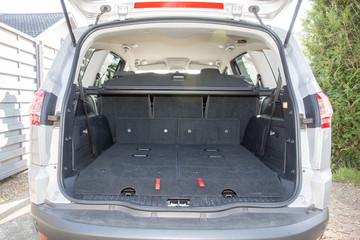 The back of a large seven 7 seater car with seats in the trunk