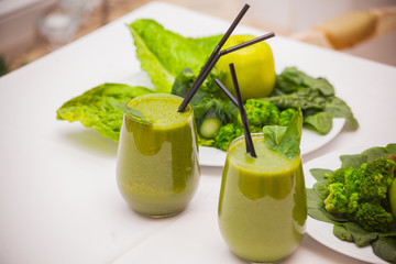 Healthy green smoothie and ingredients - superfoods, detox, diet, health, vegetarian food concept.