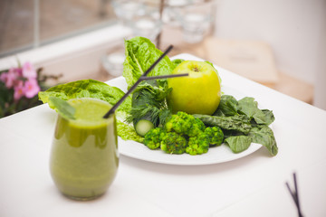 Healthy green smoothie and ingredients - superfoods, detox, diet, health, vegetarian food concept.