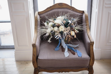 Decorative wedding bouquet on chair