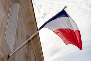 French flag in the wind on an official building