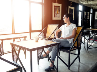 Woman takes a rest in cafe.