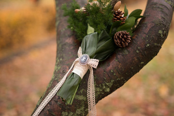 Beautiful green bridal bouquet on tree