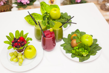 Healthy green and red smoothies and ingredients - superfoods, detox, diet, health, vegetarian food concept.