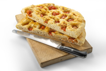 Apulian flat bread with tomatoes and knife