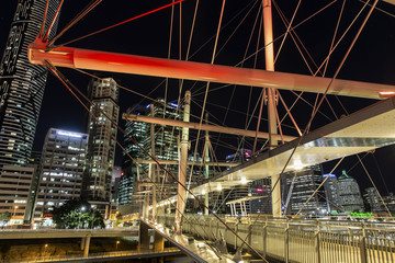 Naklejka premium Kurilpa Bridge illuminated pedestrian architecture closeup looking towards Brisbane CBD 