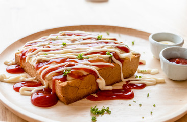 Pizza toasted bread with tomato sauce and ham cheese selective focus
