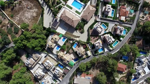 Panoramic drone view of Spanish coastal communities of La Nuccia and Benidorm - Powered by Adobe