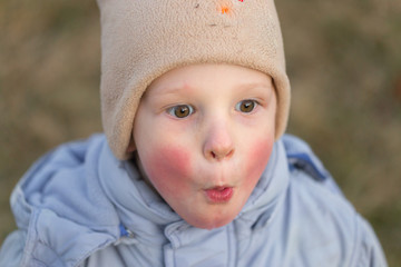 Village children. Emotional close-up portrait in nature.