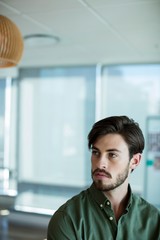 Man looking away in office