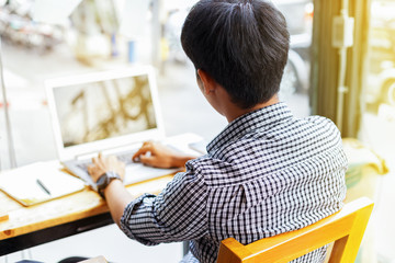 young man with laptop