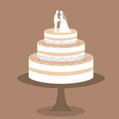Wedding cake with bride and groom figurine.