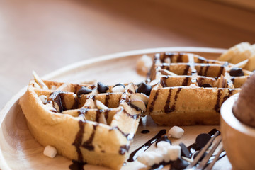 Belgian waffles with fruit and chocolate, forest fruit, all homemade, delicious batter.