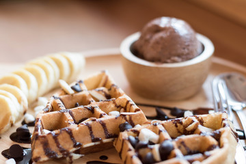 Belgian waffles with fruit and chocolate, forest fruit, all homemade, delicious batter.