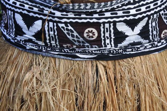 Background of traditional Pacific Island straw skirt and tapa cloth