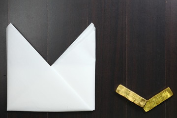 The white color paper napkin on the dark color wooden dining table floor represent the cleaning...