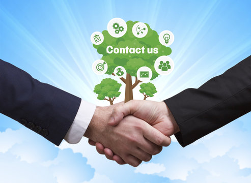 Technology, the Internet, business and network concept. Businessmen shake hands: Contact us