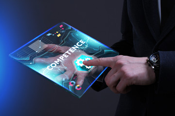 Business, Technology, Internet and network concept. Young businessman working on a virtual screen of the future and sees the inscription: Competence