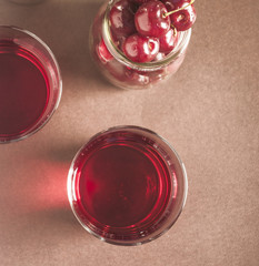 glass of fresh cherry juice and fresh cherries