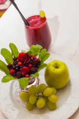 Healthy red smoothie and ingredients - superfoods, detox, diet, health, vegetarian food concept.