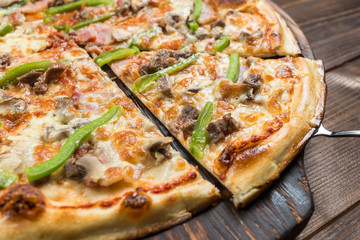 Pepperoni pizza on a board