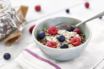 Delicious cereal breakfast with bowl and fresh fruits