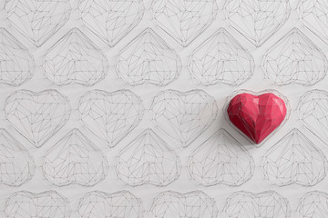 Unique Red heart on white background among the many empty wireframe hearts. Abstract polygonal heart with shadow. Love symbol. Low-poly colorful style. 3d rendering