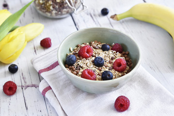 Delicious cereal breakfast with bowl and fresh fruits