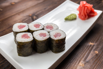 Traditional japanese sushi roll with tuna. As a whole background.
