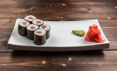 Traditional japanese sushi roll with tuna. As a whole background.