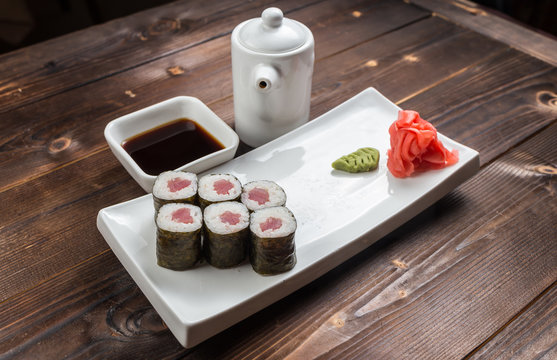 Traditional japanese sushi roll with tuna. As a whole background.
