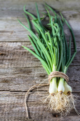 Bunch green onion on wooden table