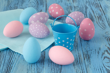 Few easter eggs on blue wooden table
