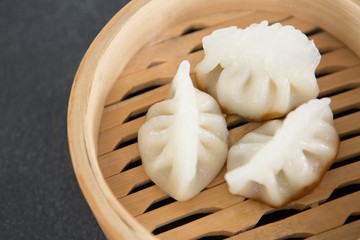 Steamed dumplings in bamboo steamer