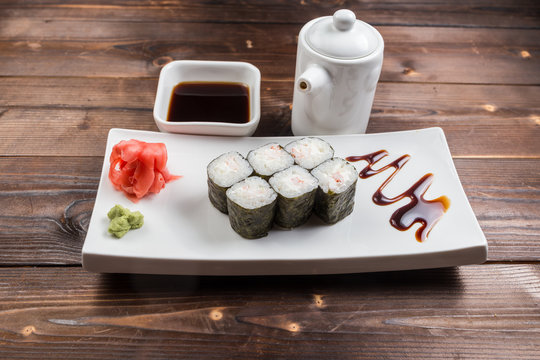 sushi roll futomaki in ceramics dish image