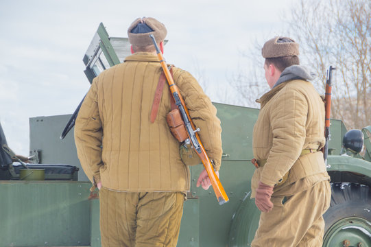near an American armored vehicle are two soldiers of the red army.