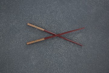 Chopsticks on stone table