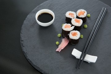 Sushi on tray with soy sauce and chopsticks