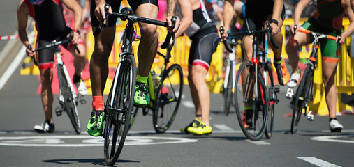 Triathlon bike ,cycling after the swimming in the transition zone - obrazy, fototapety, plakaty