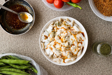 Turkish Manti Manlama / Ravioli with yogurt and fried butter sauce.