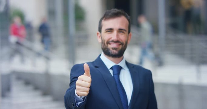 A man in a suit, looks in camera and smiles proud and sure of himself. Concept of politics, business, finance, banking, insurance and testimonials for political campaign.	