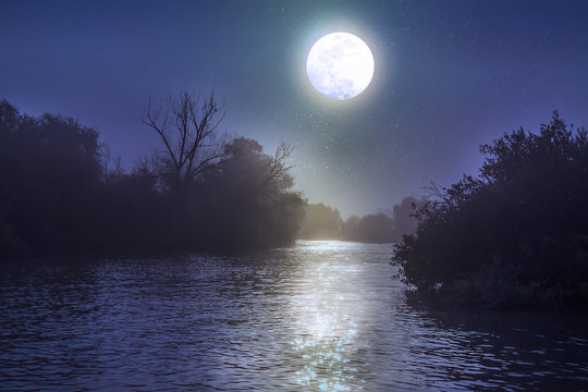 River at night with a full moon