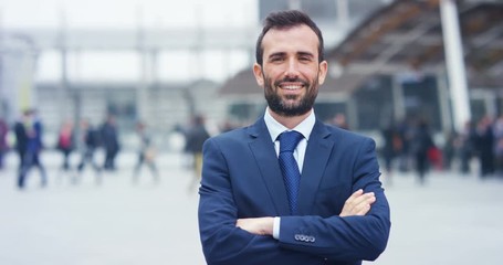 A man in a suit, looks in camera and smiles proud and sure of himself. Concept of politics, business, finance, banking, insurance and testimonials for political campaign.	 - Powered by Adobe