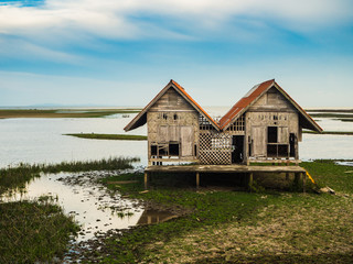 Dilapidated of house in lagoon at Talaynoi, Phattalung province, Thailand.