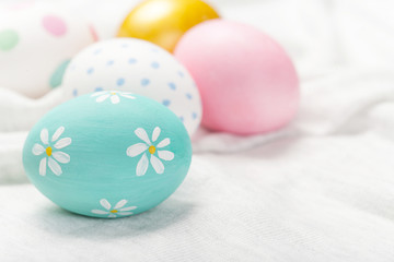 Obraz na płótnie Canvas Colorful Easter Eggs on white with copy space. 